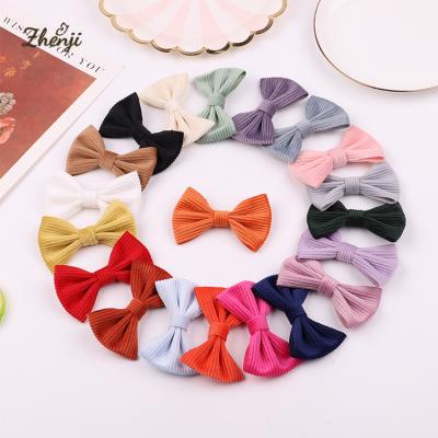 China Autumn and winter sweet children's corduroy hairpin cute girl's bow side clip all-wrapped cloth baby hair accessories 2357 for sale