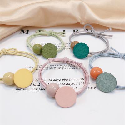 China Free Shipping Sweet Candy Color Round Beads Korean High Clear Adult Twine Elastic Hair Band Wooden Head Elastic Geometric Lovely for sale