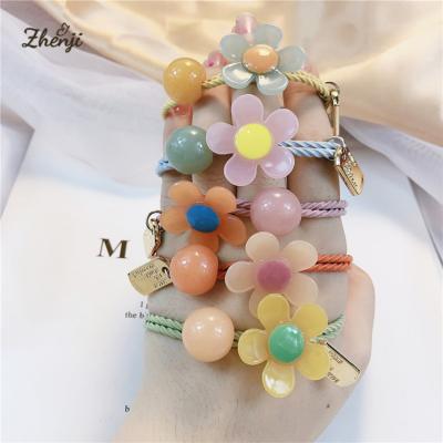 China Soft Free Shipping Jelly Flower Pearl Hair Rope Kids Colorful Acrylic Rubber Bands Soft Main Hair Ring for sale