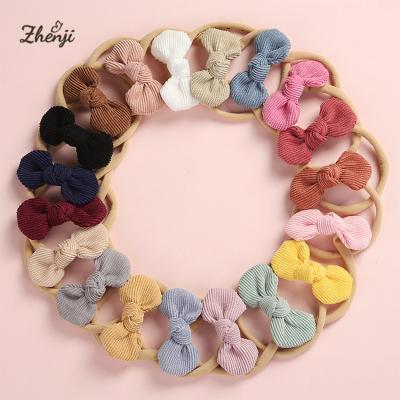 China Super Soft Baby Corduroy Bowknot Hair Bands Solid Color Soft Round Cute Infant Hair Band Seamless Headbands for sale