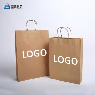 China Printing Logo Brown Kraft Paper With Handle For Shopping Packaging Bags for sale