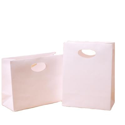 China Custom Wholesale White Kraft Paper Takeaway Die Cut Handle Paper Bag For Fast Food Packaging for sale