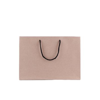 China Wholesale Custom Kraft Party Shopping Colorful Paper Gift Bag With Rope Handle for sale