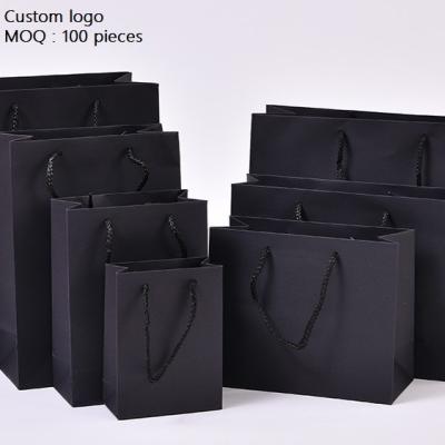 China Recycled Materials Wholesale Luxury Paper Gift Bags Paper Bag With Handle for sale