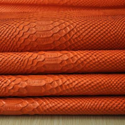 China New Viable Orange Color Python Skin Knife-Cut Pattern Cow Grain Hide Leather For Tote Bags for sale