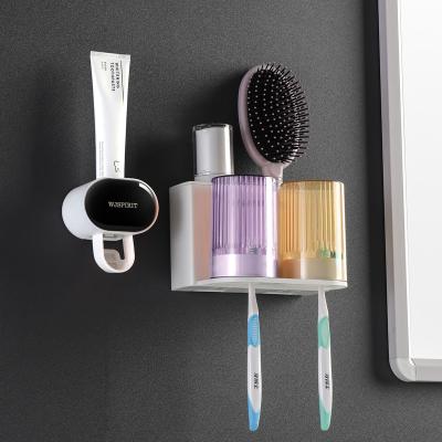 China Sustainable Self Dispensing Kids Toothbrush Toothpaste Holder With Cups for sale