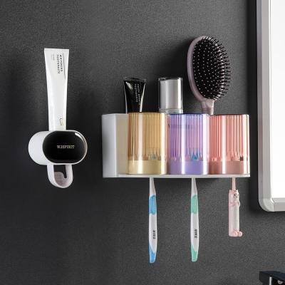 China Sustainable Bathroom Accessories Set Automatic Wall Mount Toothbrush Holder Toothpaste Dispenser for sale