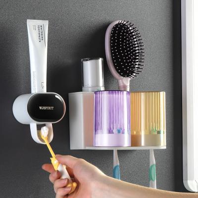 China Sustainable Self Adhesive Eco-Friendly Plastic Automatic Toothpaste Dispenser Toothbrush Holder for sale