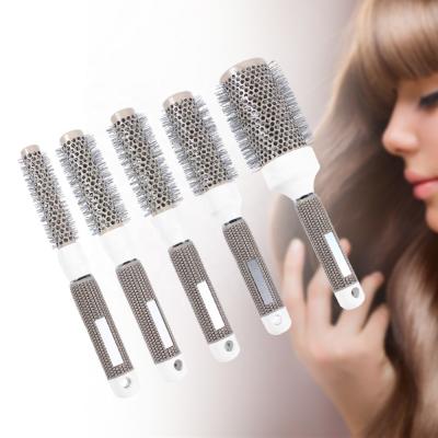 China Modern Professional Hairdressing Iron Round High Temperature Resistant Ceramic Comb Styling Tool for sale