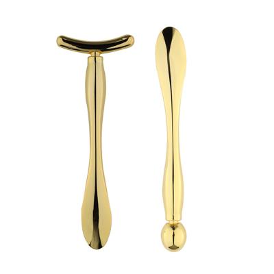 China 2021 Hot Selling Amazon Gold Eye Massage Stick Applicator Anti Eye Massage Facial Tool Zinc Alloy Wrinkle Cream for sale