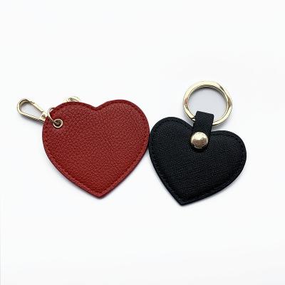 China Promotion Price Tag Business Genuine Leather Goods Layer First Whip Leather Keyholder Heart Shape Key Chain for sale