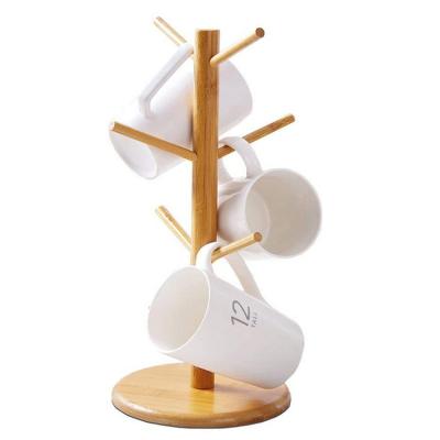 China Sustainable Rustic Nature Bamboo Tree Flower Rack Stand Kitchen Standing Storage With 6 Hooks for sale