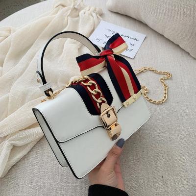 China Fashion Solid PU Leather Trim With Scarf Chain Tote Handbag Cross Shoulder Small Jelly Mini Bag New Ladies Hand Bags for sale