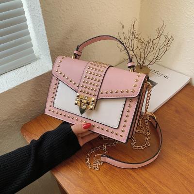 China Fashion Summer Fashion Candy PU Round Rivets Purses and Handbags 2022 Shoulder Bag Cross Chain Women's Small Bags for sale