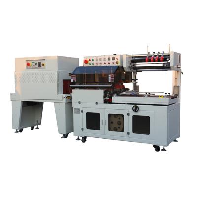 China Automatic Plastic CLOTHING L Wraps Bar Sealer Shrink Heat Cutting Wrapping Machine for sale