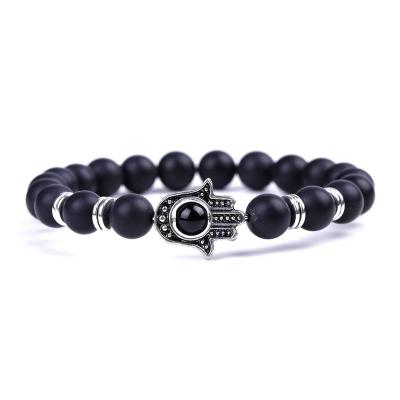 China Natural CLASSIC Fashion Black Stone None Wax Lava Rock Stone Essential Oil Diffuser Hamsa Hand Coated Bracelet for sale