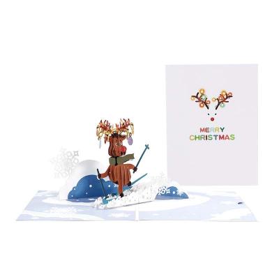 China Europe/America/Oceania Handmade Paper Cut Elk 3d Christmas Ski Sound Greeting Card for sale