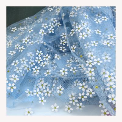 China Hot Selling 100% Polyester Organic Fabric Mesh Offset Printed Little Flower Blue Mesh Printed Fabric for sale