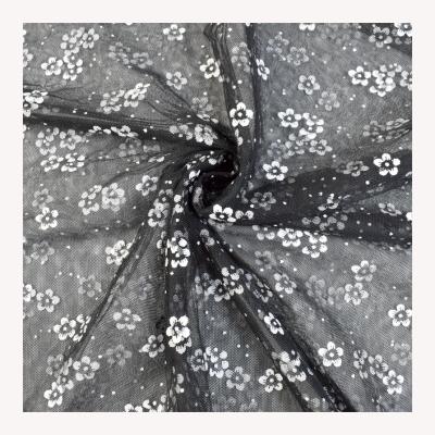 China Organic Glow In The Dark Black Tulle Mesh Fabric White Floral American Halloween Party Decoration for sale