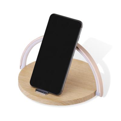 China Mobile Phone 2022 Patent New Design Qi Wireless Charger Led Night Lamp Functional Magnetic Wireless Charger With Cell Phone Stand Holder for sale