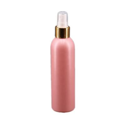 China Personal Care Cosmo Round 200ml HDPE Plastic Bottle With Gold Aluminum Sprayer Packaging PE Cosmetic Sprayer Bottle for sale