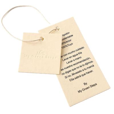 China Sustainable Custom Recycled Hang Tags Vanilla Paper Hang Tag String Hang Tags for sale