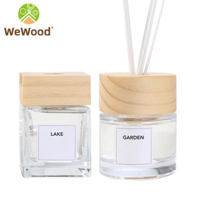 China Europe Luxury Sample Round Home Aroma Oil Empty Reed Glass Diffuser Bottle With Wooden Lid for sale