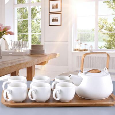 China Sustainable Hot Selling Porcelain Wooden Handle Teapot White Tea Set With Bamboo Tray for sale