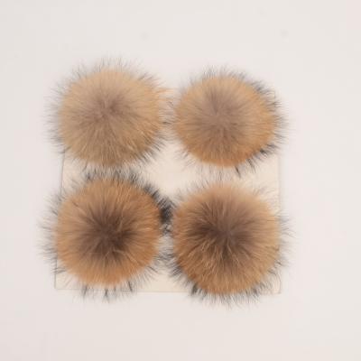 China Eco-friendly ornamental fluffy real fur pom pendants raccoon fur head chain ball with long hairs for sale