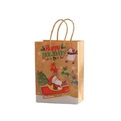 China Cheap Biodegradable Christmas Gift Bags Small Merry Christmas Paper Bags With Handle Custom Printed Shopping Bag for sale