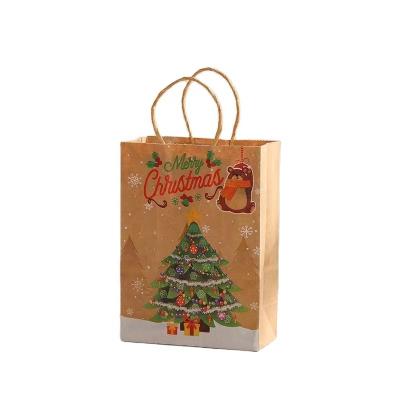 China Biodegradable Custom Christmas Paper Carrier Bags Brown Cheap Paper Bag With Handles Snowflakes Merry Christmas Candy Cookie Packaging Bag for sale