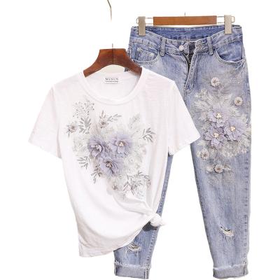 China Anti-pilling 3D Flower Cotton T-shirt +Calf-length Sequined Beaded Jeans Clothing Ladies Suits Sets Mid Calf Jean Suits Summer for sale