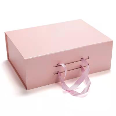 China Handmade Custom Logo Luxury Pink Magnetic Gift Kraft Paper Cardboard Folding Boxes With Ribbon for sale