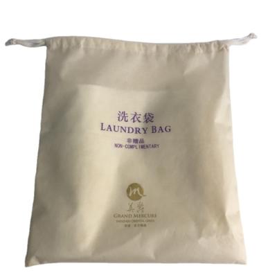 China 35*50CM Hospitality Hotel 40G Eco-friendly Laundry Bags Nonwoven Heavy Duty Drawstring Travel Bag Laundry Dirty Clothes Bag for sale