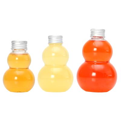 China OEM 100ml 200ml 300ml Transparent Beverage Squash Shaped Pet Juice Beverage Bottle Kid With Twist Off Cap for sale