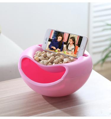 China Multi-Functional Stylish Multi-Function Nut Bowl Lazy Snack Storage Box Storage Box Lazy Bowl With Mobile Phone Holder Slot for sale