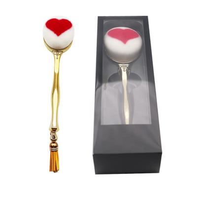 China Angular Blush Heart Gold Three-Dimensional Pattern Tassel Long Handle Brushes Single Foundation Brush for sale