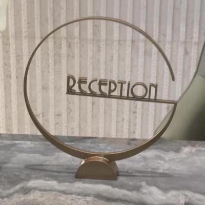 China Outdoor Creative Hotel table board table board room hotel reception board high grade solid aluminum character metal carving logo for sale