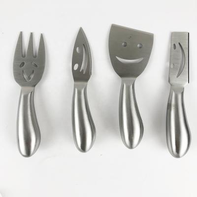 China Size Viable Quality Face Kitchen Restaurant 4pcs Stainless Steel Interesting Smile Cheese Knife Set For Cheese Butter Cutting for sale