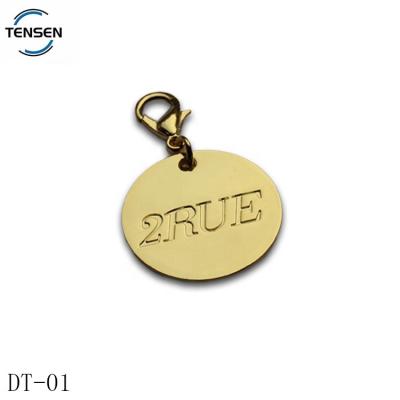 China Custom Engraved Round Metal Dog Collar Gold Color Metal Accessory Charms Letter Tags Europe Hugger Key Chain for sale