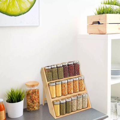 China Sustainable Wooden three-storey storage rack movable tabletop storage rack kitchen condiment storage rack for sale