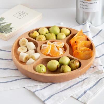 China Sustainable Creative solid wood lattice round fruit plate high-end snack plate high-end household tray for sale