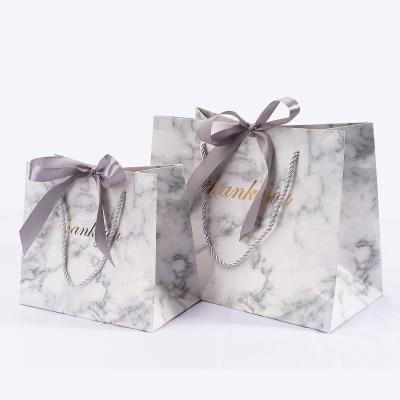 China Factory direct custom ribbon paper bag recyclable marbled paper bags for clothing packaging with handle for sale