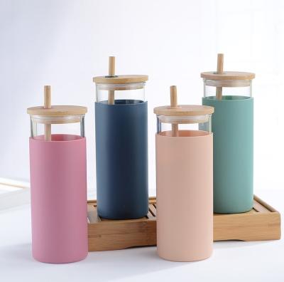 China Sustainable Silicone 480ml Sleeve Glass Water Bottle Eco Friendly Glass Lid Tumbler With Straw for sale