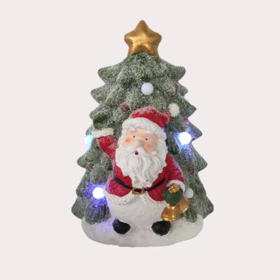 China Resin Santa Claus Green Worldwide Tree with LED Lights and Music on Christmas Tree for Holiday Decoration for sale