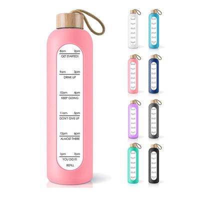 China 1000ml viable large capacity glass with bamboo lid and silicone cover device time-calibrated water bottle for sale