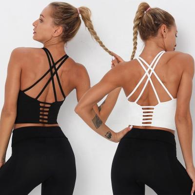 China 2021 Breathable Hollow Cross Back Sport Bra Padded Strappy Cross Cropped Bras For Yoga Workout Fitness Impact Low for sale