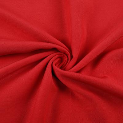 China Stock lot density 68*68 density red single reactive dyeing 100 rayon fabric for ladies dressing for sale