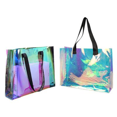 China Hot Sale Handled Female Holographic Transparent Handbags Beach Bag Shopping Tote Bag Plastic Handle Clear PVC Laser Bag for sale