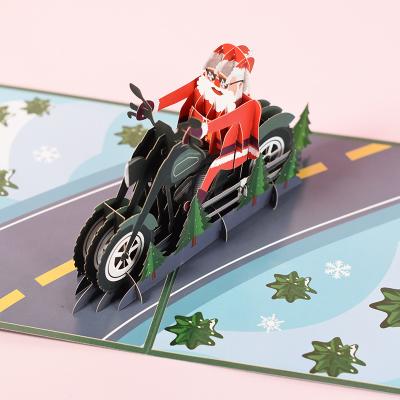 China Europe 3d Christmas Cards Three-Dimensional Greeting Holiday Blessing 3d Santa Claus Motorcycle Pop Up Card for sale